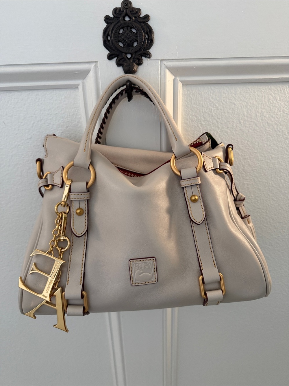 Dooney & Bourke Cream Leather Shoulder Bag with Gold Hardware and Charm